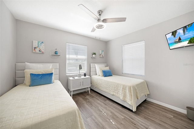 2621 Larkspur Dr, Punta Gorda, FL 33950 - bedroom featuring baseboards, a ceiling fan, and wood finished floors