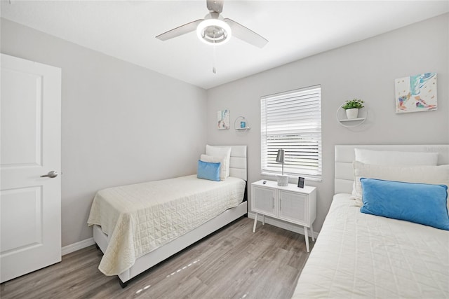 2621 Larkspur Dr, Punta Gorda, FL 33950 - bedroom featuring baseboards, a ceiling fan, and wood finished floors