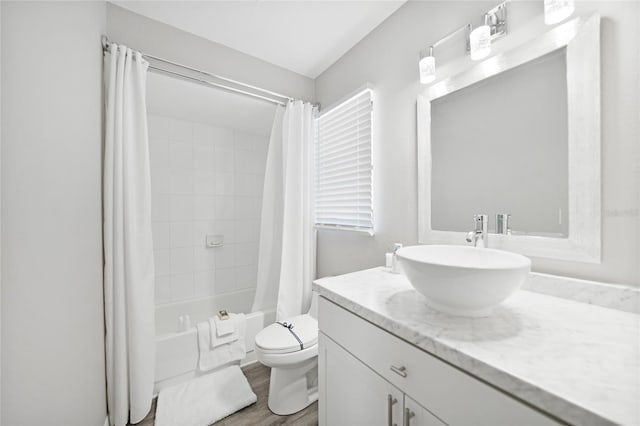 2621 Larkspur Dr, Punta Gorda, FL 33950 - bathroom featuring shower / bathtub combination with curtain, vanity, toilet, and wood finished floors