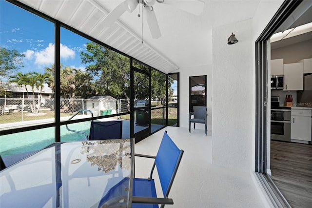 2621 Larkspur Dr, Punta Gorda, FL 33950 - unfurnished sunroom featuring plenty of natural light, outdoor dining area, and a ceiling fan