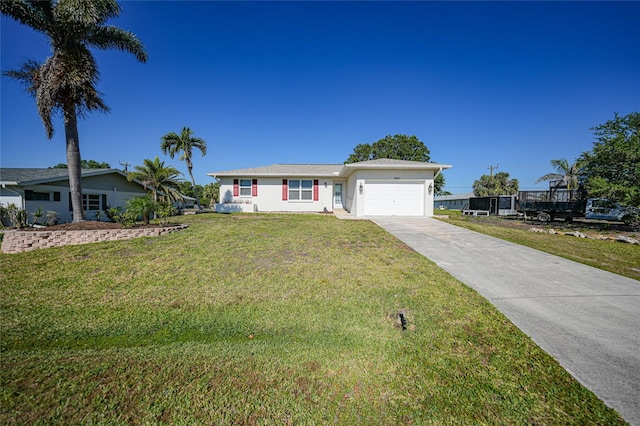 2621 Larkspur Dr, Punta Gorda, FL 33950 - single story home featuring a garage, a front yard, concrete driveway, and stucco siding
