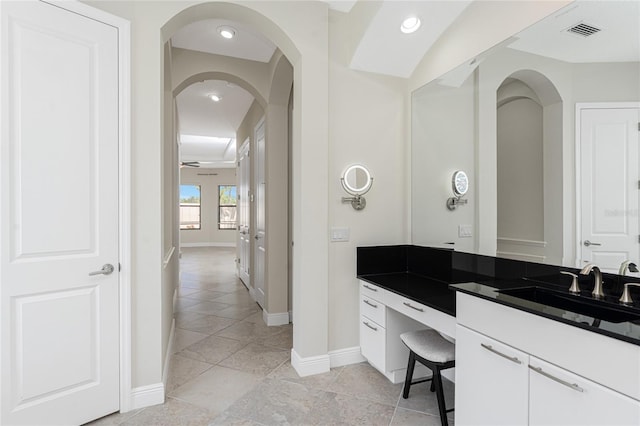 bathroom featuring vanity, tile patterned flooring, visible vents, recessed lighting, and baseboards