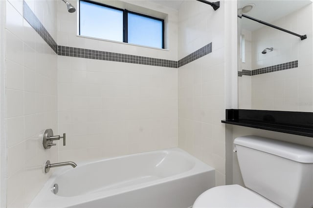 bathroom featuring toilet and tub / shower combination