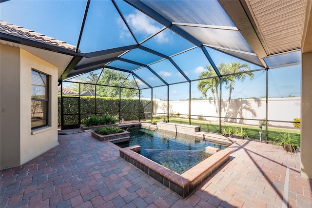view of swimming pool featuring a fenced in pool, a patio area, and glass enclosure