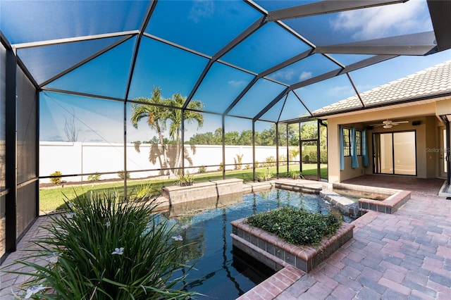 view of pool with a water view, a pool with connected hot tub, a patio, and a lanai