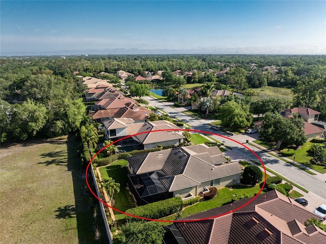 bird's eye view with a residential view and a water view