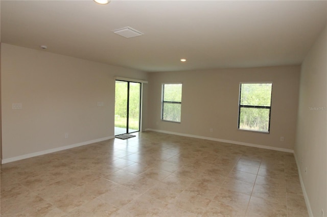 spare room featuring visible vents, baseboards, recessed lighting, and light tile patterned flooring