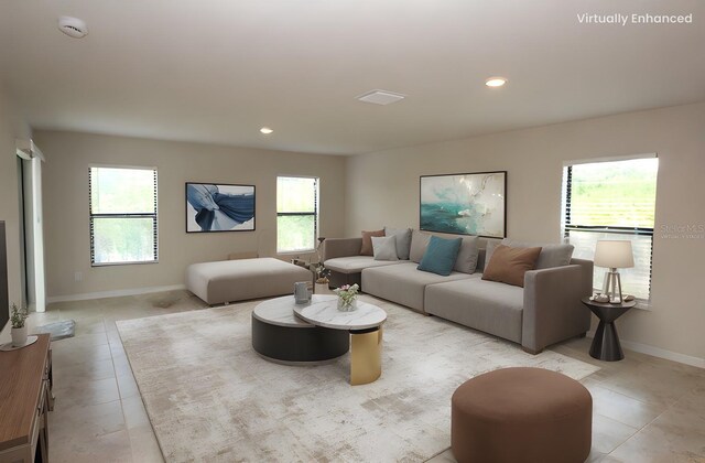 17374 Gadsen Ave, Port Charlotte, FL 33948 - living room featuring light tile patterned flooring, baseboards, and recessed lighting