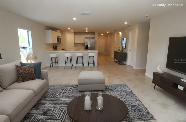 17374 Gadsen Ave, Port Charlotte, FL 33948 - living area with baseboards and recessed lighting