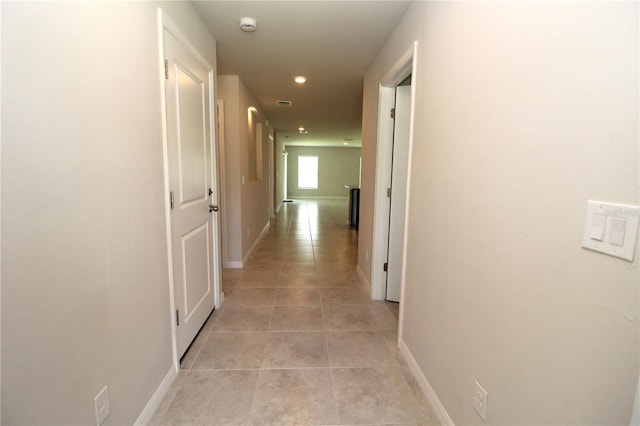 4071 Conestoga St, Port Charlotte, FL 33948 - hallway with light tile patterned floors, baseboards, and recessed lighting