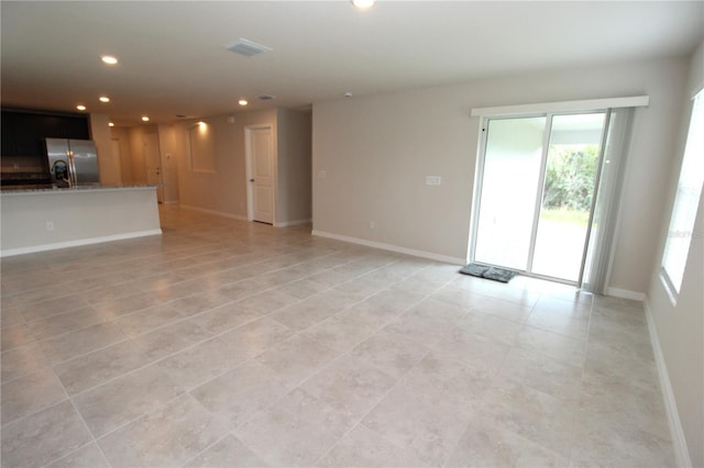 4071 Conestoga St, Port Charlotte, FL 33948 - unfurnished living room with recessed lighting, visible vents, baseboards, and light tile patterned flooring