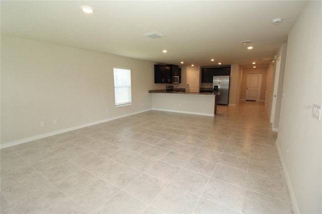 4071 Conestoga St, Port Charlotte, FL 33948 - unfurnished living room featuring recessed lighting, baseboards, and light tile patterned flooring