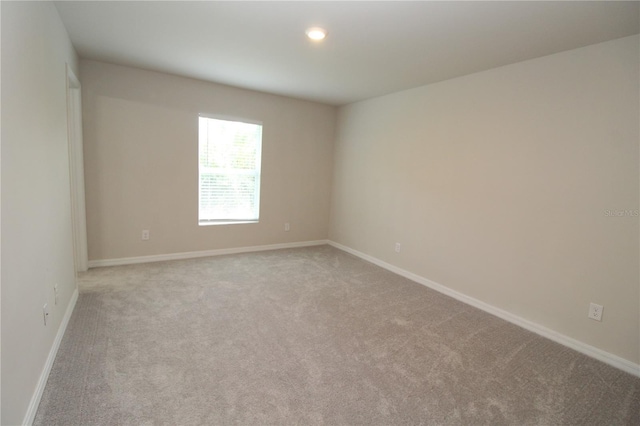 4071 Conestoga St, Port Charlotte, FL 33948 - spare room with baseboards, recessed lighting, and light carpet