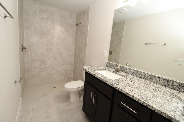 4071 Conestoga St, Port Charlotte, FL 33948 - bathroom with tile patterned flooring, vanity, a tile shower, and toilet