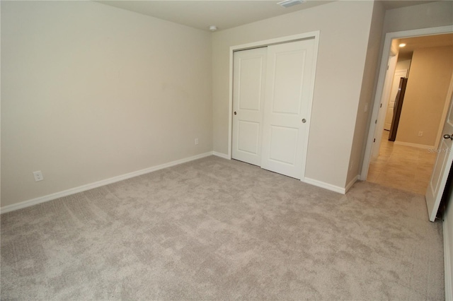 4071 Conestoga St, Port Charlotte, FL 33948 - unfurnished bedroom with a closet, baseboards, light colored carpet, and visible vents