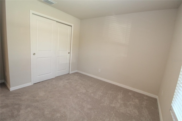 4071 Conestoga St, Port Charlotte, FL 33948 - unfurnished bedroom with visible vents, baseboards, carpet flooring, and a closet