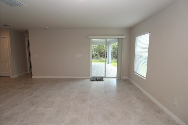 4071 Conestoga St, Port Charlotte, FL 33948 - spare room with a wealth of natural light, light tile patterned floors, visible vents, and baseboards