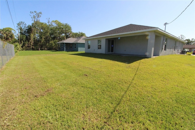 4071 Conestoga St, Port Charlotte, FL 33948 - view of yard featuring central AC and fence