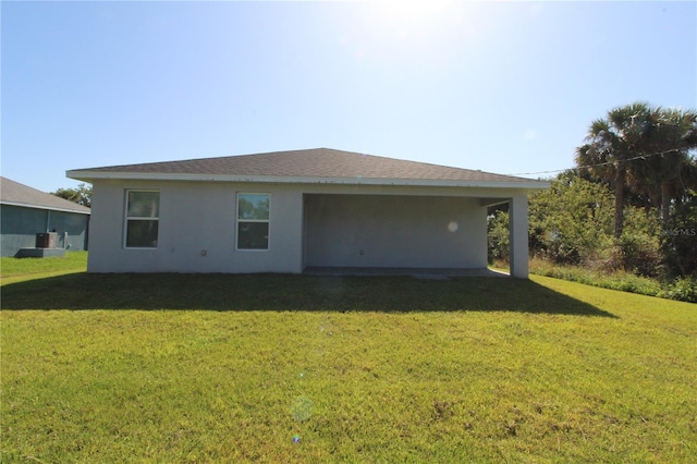 4071 Conestoga St, Port Charlotte, FL 33948 - back of property with a yard and stucco siding