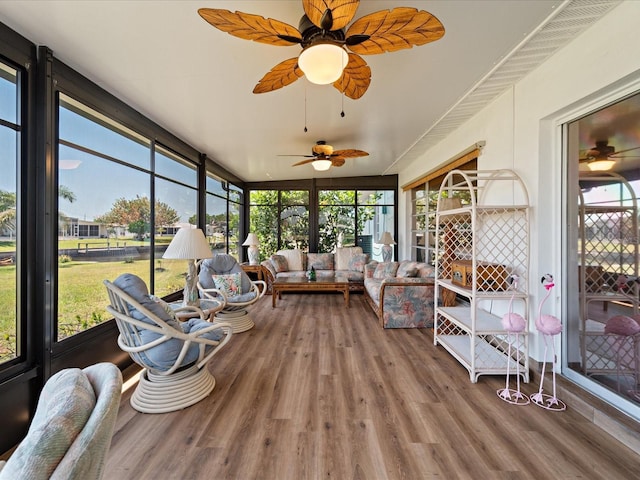 sunroom / solarium featuring outdoor lounge area, a healthy amount of sunlight, and ceiling fan