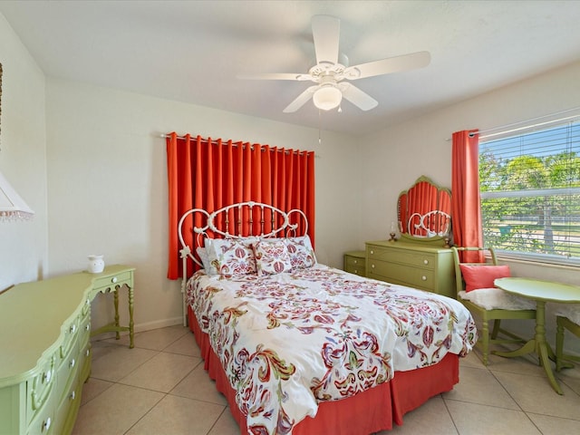 bedroom featuring light tile patterned flooring and a ceiling fan