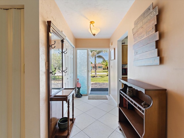entryway featuring light tile patterned floors