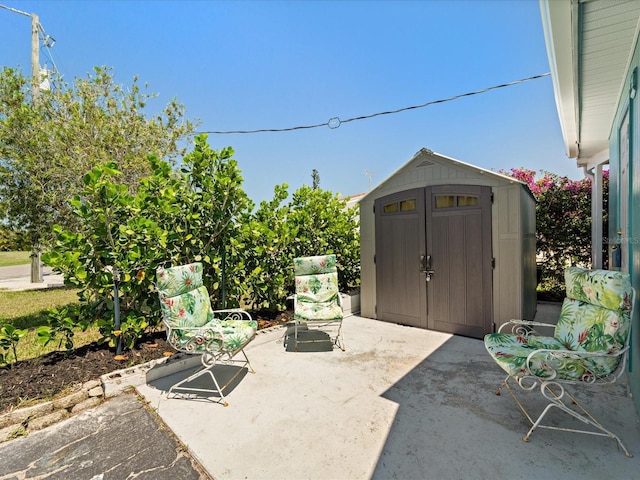 view of patio featuring a storage shed and an outdoor structure
