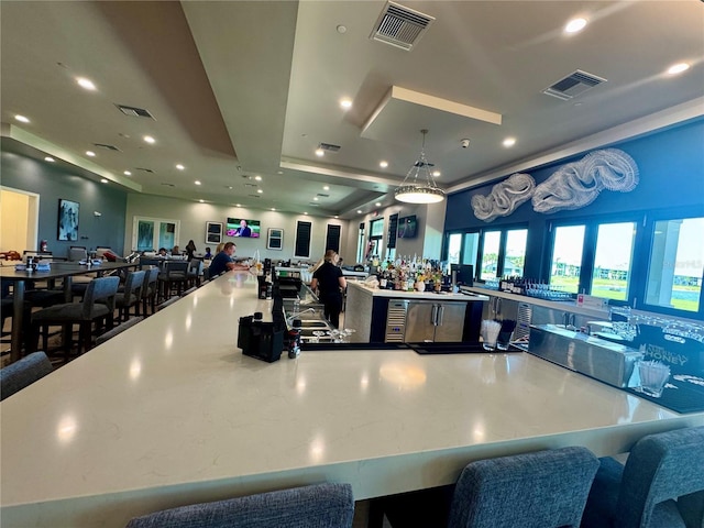 14413 Heritage Landing Blvd, Punta Gorda, FL 33955 - kitchen with open floor plan, a spacious island, recessed lighting, and hanging light fixtures