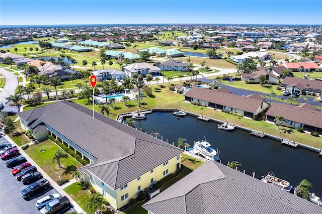 aerial view featuring a water view and a residential view