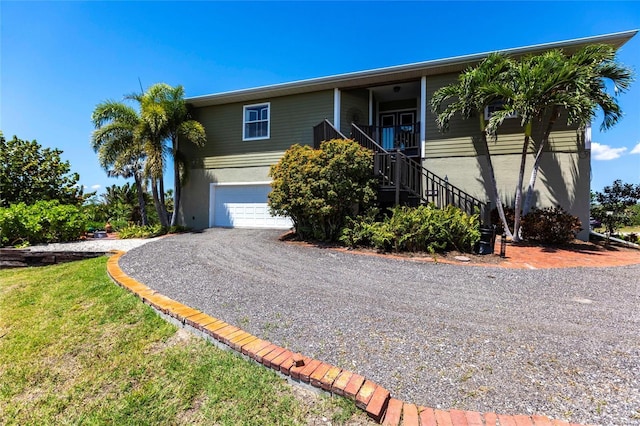 3712 Balboa Ct, Punta Gorda, FL 33983 - view of front of property featuring stairway, driveway, and a garage