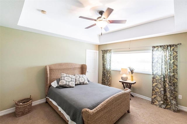 3712 Balboa Ct, Punta Gorda, FL 33983 - bedroom with carpet, baseboards, a tray ceiling, and a ceiling fan