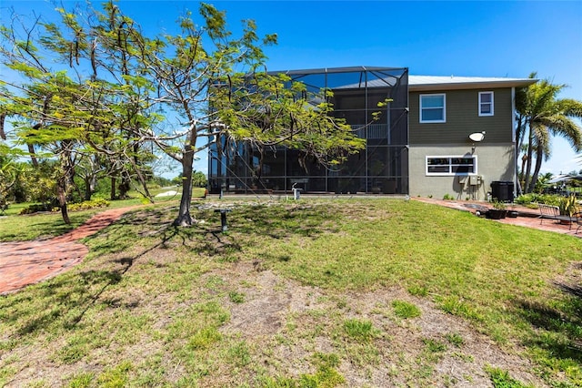 3712 Balboa Ct, Punta Gorda, FL 33983 - view of grassy yard with a lanai and central air condition unit