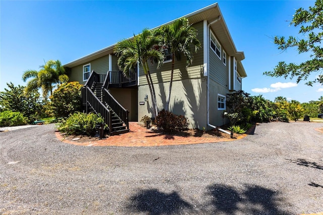 3712 Balboa Ct, Punta Gorda, FL 33983 - view of side of property featuring stairway and stucco siding