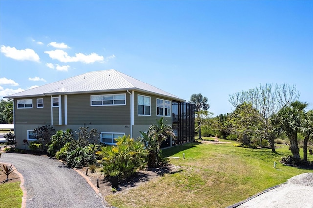 3712 Balboa Ct, Punta Gorda, FL 33983 - view of home's exterior with a yard and metal roof