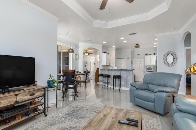 16450 Bauers Ave, Port Charlotte, FL 33954 - living area with ceiling fan, ornamental molding, and visible vents