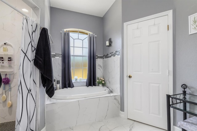 16450 Bauers Ave, Port Charlotte, FL 33954 - bathroom featuring marble finish floor, a garden tub, and a marble finish shower