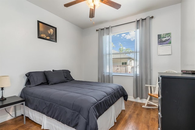 16450 Bauers Ave, Port Charlotte, FL 33954 - bedroom with a ceiling fan, baseboards, and dark wood-style floors