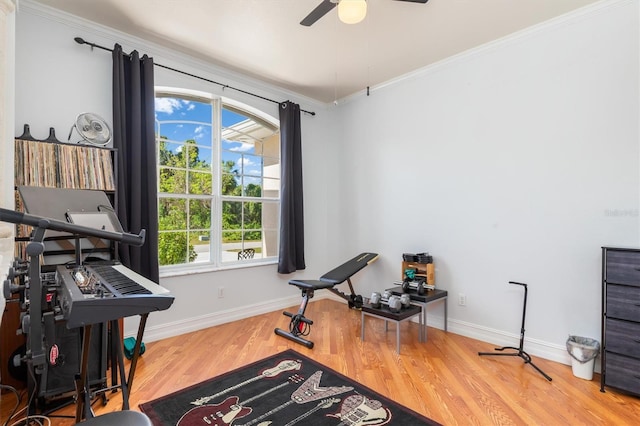 16450 Bauers Ave, Port Charlotte, FL 33954 - interior space featuring crown molding, wood finished floors, ceiling fan, and baseboards