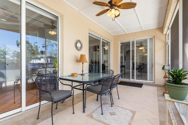 16450 Bauers Ave, Port Charlotte, FL 33954 - sunroom / solarium with tile patterned flooring, a ceiling fan, and outdoor dining area