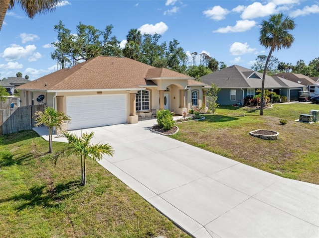 16450 Bauers Ave, Port Charlotte, FL 33954 - single story home featuring stucco siding, driveway, a front yard, a garage, and fence