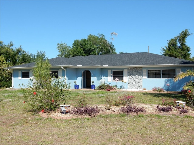 1233 Dewhurst St, Port Charlotte, FL 33952 - ranch-style house with stucco siding and a front lawn