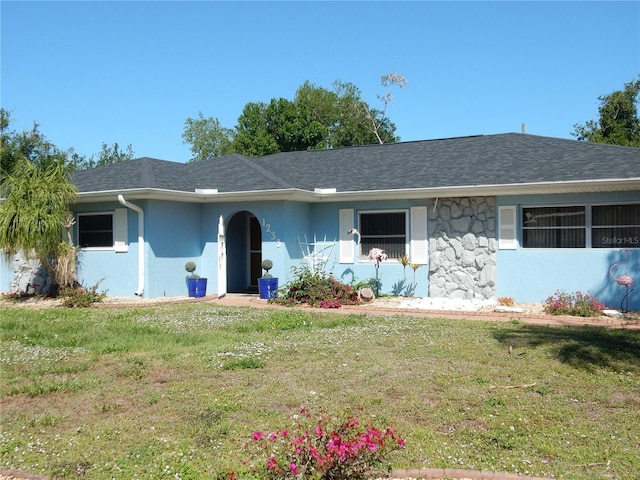 1233 Dewhurst St, Port Charlotte, FL 33952 - ranch-style home featuring a front yard, stucco siding, and a shingled roof