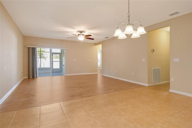spare room with light tile patterned flooring, visible vents, baseboards, and ceiling fan with notable chandelier