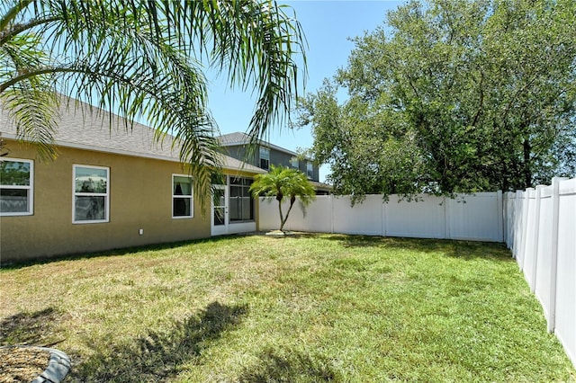 view of yard with a fenced backyard