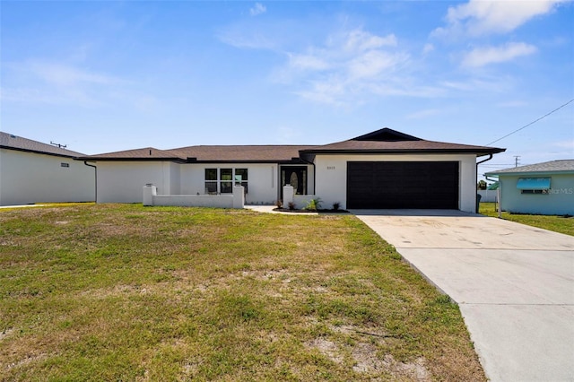 3315 Elkcam Blvd, Port Charlotte, FL 33952 - view of front of home with an attached garage, concrete driveway, stucco siding, and a front lawn
