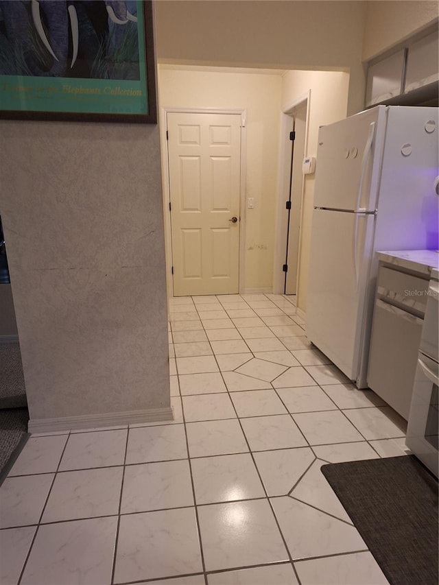 kitchen with freestanding refrigerator