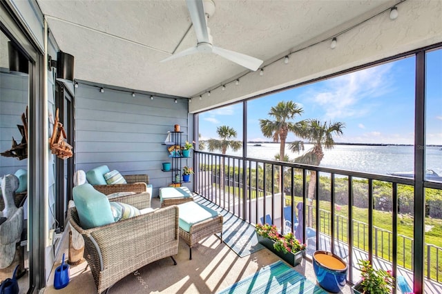1701 Beach Rd Unit 305, Englewood, FL 34223 - balcony featuring ceiling fan and a water view