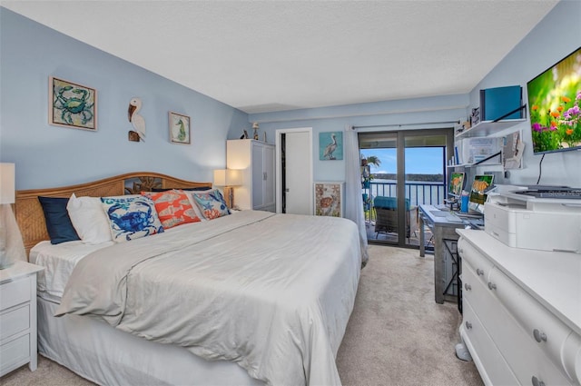 1701 Beach Rd Unit 305, Englewood, FL 34223 - bedroom with access to outside and light carpet