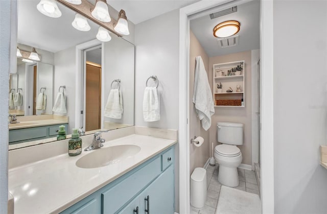 1701 Beach Rd Unit 305, Englewood, FL 34223 - full bath with tile patterned flooring, vanity, visible vents, and toilet