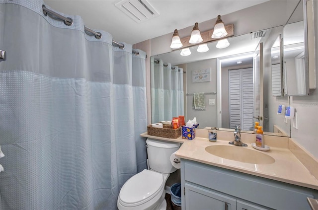 1701 Beach Rd Unit 305, Englewood, FL 34223 - full bathroom with a shower with shower curtain, vanity, visible vents, and toilet